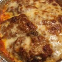 Chicken Parmigiana · Breast of chicken lightly breaded topped with mozzarella in a tomato sauce.