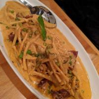 Red Curry · Coconut milk, milk, red chili pasta, bell peppers, bamboo shoots, sweet peas and basil leave...