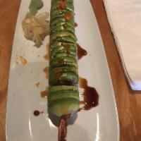 Dragon Roll · Tempura shrimp, asparagus, scallion, seed, masago, topped with avocado. Rice on the outside.