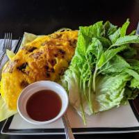 Vietnamese Crepe · Prawns, pork slices and bean sprouts in pan-fried batter mixed with coconut milk served with...