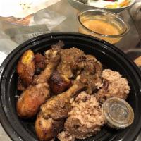 Jerk Chicken Plate · Served with rice, beans, and fried plantains.