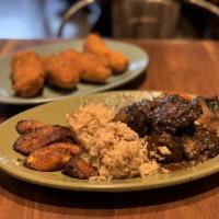 Beef Oxtails Plate · Served with rice, beans, and fried plantains.