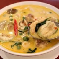 Green Curry · Green curry paste in coconut milk with eggplant, bamboo shoots, bell peppers and basil.