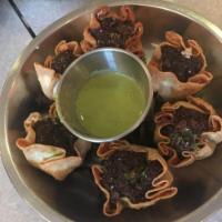 Falafel Dumplings · 6 pieces. Chickpea, onion, jalapeno parsley, cilantro, cumin with tahini mint sauce. Vegan.