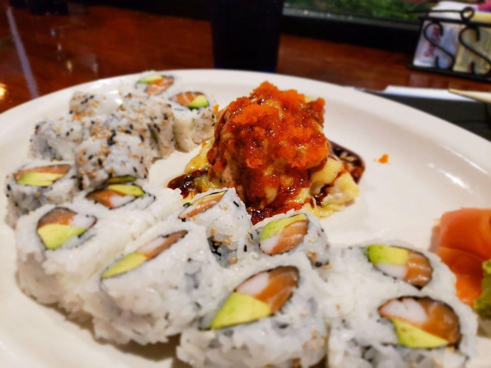 Volcano Roll · Crab stick, cream cheese, inside, topped with avocado, baked fish, eel sauce and tempura crumbles.