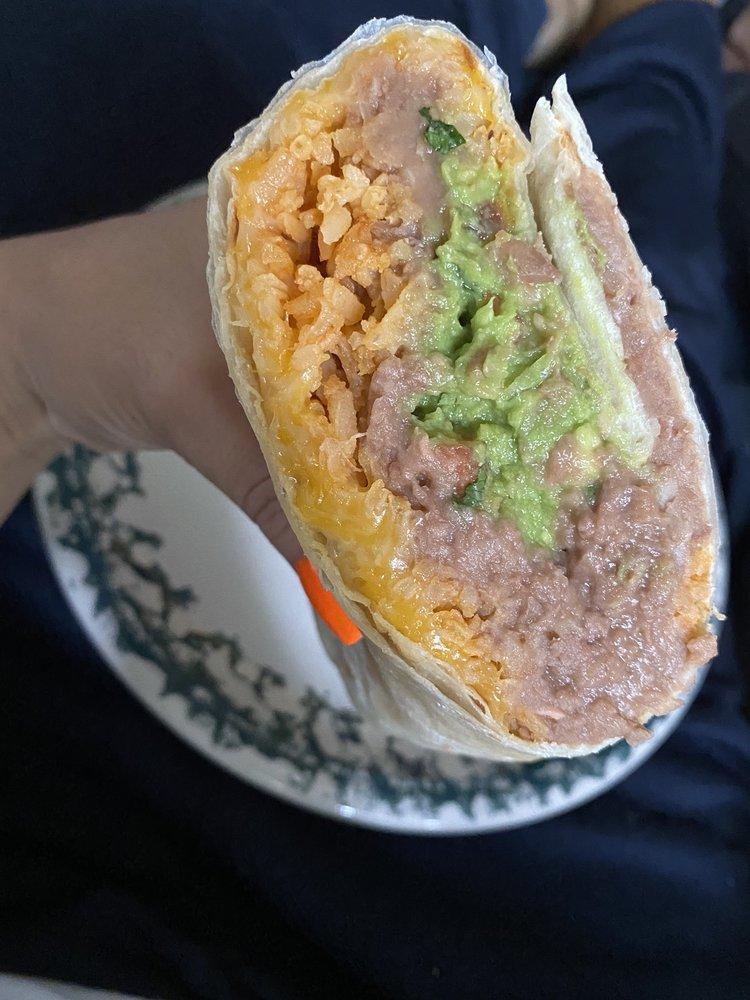 Veggie Burrito · Lettuce, cabbage, tomatoes, onions, cilantro, jalapenos, avocado and cheddar cheese. Add meat for an additional charge.