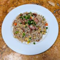 Bacon Fried Rice · Fresh, jasmine rice stir fried with bacon, egg, mixed vegetables, topped with bean sprouts.