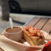 Lobster Roll · Atop toasted, freshly baked artisan split-top bun. Bread lightly dressed with mayo and toppe...