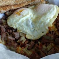Corned Beef Hash Skillet · 2 eggs served over a mound of homemade corned beef hash with toast. Served to former first l...