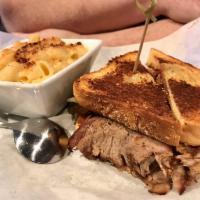 Hollywood BBQ Tri Tip Sandwich · Certified Angus beef tri-tip smoked low and slow, shaved thin and stacked high on Texas toas...