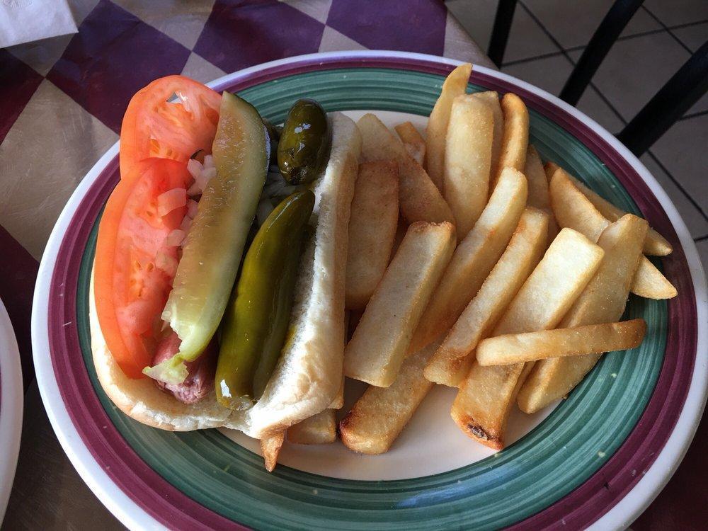 Hot Dog · Chicago style. Mustard relish onion, tomato pickle sport peppers and celery salt.