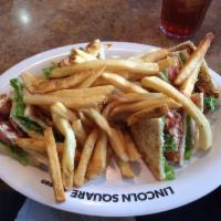 Turkey & Bacon Club Sandwich · Triple decker club. Turkey, ham, bacon, lettuce, tomato & mayo. Your choice of two sides.