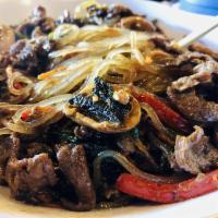 Japchae · Glass noodles with red peppers, carrots, onions, spinach, mushrooms and thinly sliced marina...