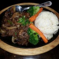 Bulgogi · Thinly sliced ribeye beef marinated and aged with a homemade sauce, sauteed with mushrooms, ...