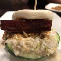 Pork Buns · Slice of savory pork belly dressed with Bonchon soy garlic sauce and topped with cucumbers, ...