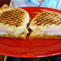 Cuban Sandwich · Seasoned cooked fresh ham, tavern ham, melted provolone cheese, spicy brown mustard and pick...