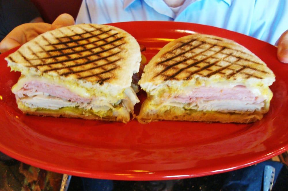 Cuban Sandwich · Seasoned cooked fresh ham, tavern ham, melted provolone cheese, spicy brown mustard and pickles on panini grilled ciabatta hoagie.