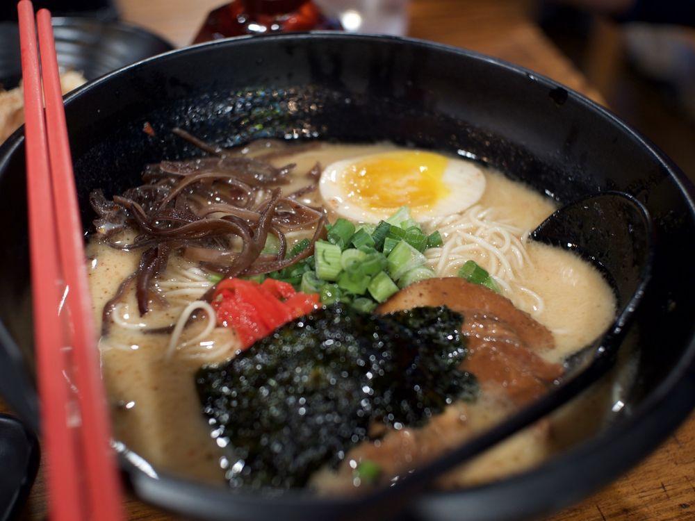 Spicy Tonkotsu Ramen · Our specialty, Hakata style Spicy ramen with pork broth cooked to perfection for roughly 12 to 17 hours, served with straight noodle, pork chasu, boiled egg, scallion, black mushroom,red ginger & dry seaweed.