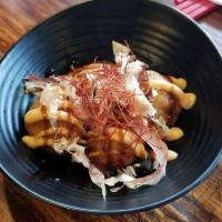 Takoyaki · Battered octopus over egg tartar topped with spicy mayo, ell sauce, scallion and bonito flak...