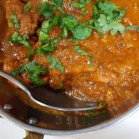 Chicken Curry · Traditional Indian curry prepared with tender boneless chicken in a special gravy sauce.