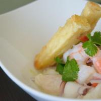 Mixed Ceviche · Fresh cut fish marinated in freshly squeeezed limes, onion and cilantro. Served with yuca fr...