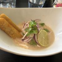 Fish Ceviche · Fresh cut fish marinated in freshly squeeezed limes, onion and cilantro. Served with yuca fr...