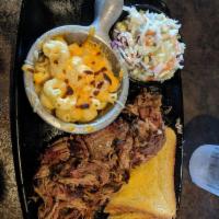 Pulled Pork Dinner · Our pork has been slow smoked for at least 12 hours before being hand pulled. Piled high wit...