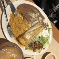 Chimichanga · A flour tortilla stuffed with your choice of chunks of beef or spicy chicken, then deep-frie...