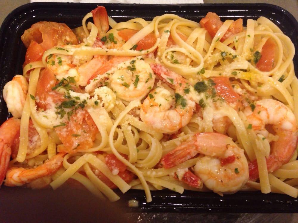 Shrimp Scampi Pizza · Sauteed shrimp, scampi sauce, garlic, fresh basil, sliced tomatoes and mozzarella cheese. No sauce.