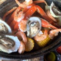 Billy's Ultimate Steam Pot · 1 cluster of crab legs, 8 shrimp, 4 oysters, potatoes and corn simmered in a garlic and whit...
