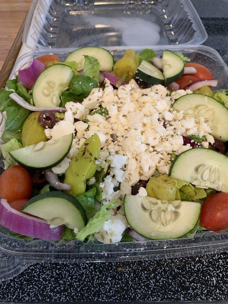 Greek Salad. · GREENS TOPPED W/ TOMATOES
PEPPERONCINIS, KALAMATA OLIVES, RED
ONIONS, FETA & CUCUMBERS, HERBS & SERVED
W/ GREEK DRESSING