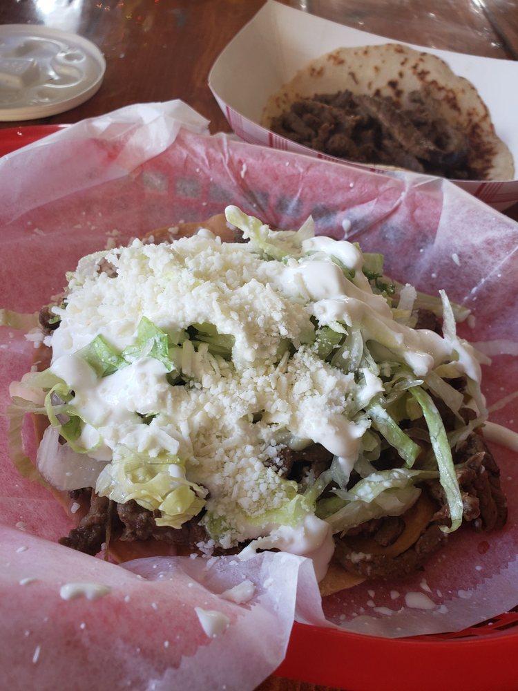 Tostada · Fried corn tortilla, topped with beans, your choice of meat, lettuce, sour cream and cheese.