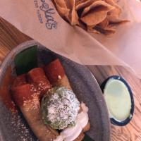 Vegan Potato Taquitos · Three hand rolled potato taquitos , fresh guacamole, salsa guajillo, vegan crema and queso