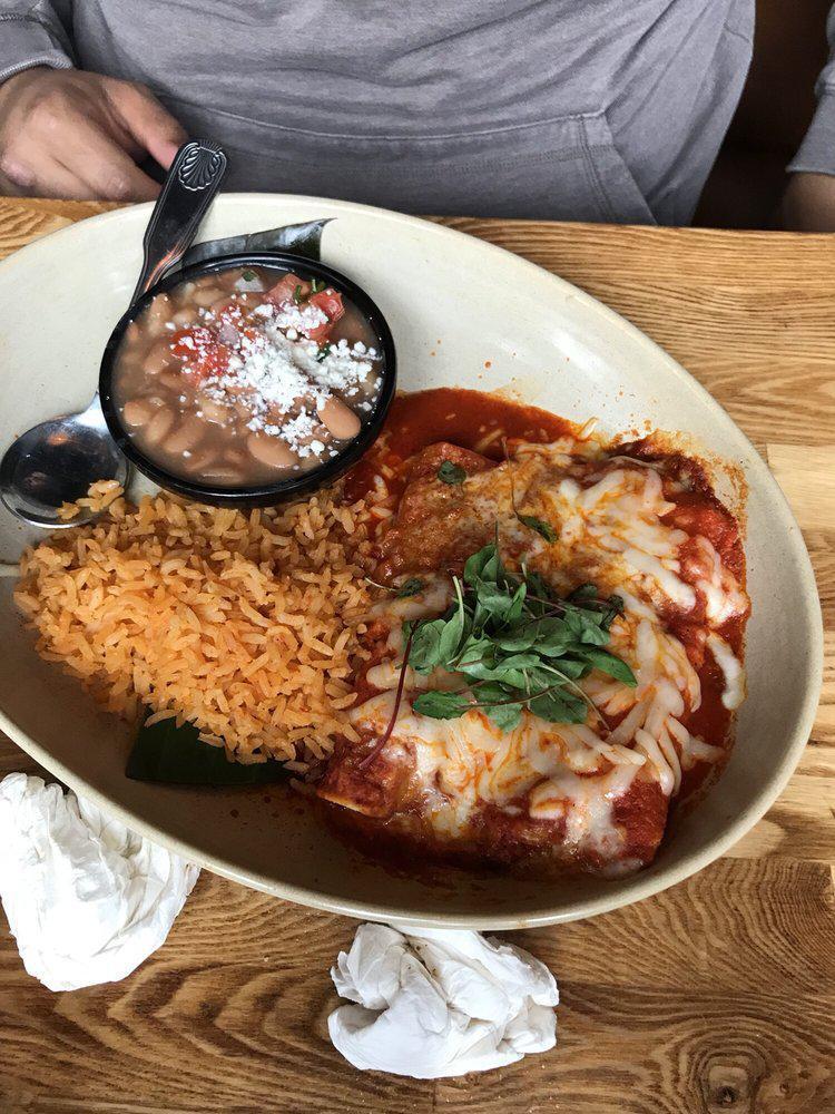 Short Rib Enchiladas · Braised short rib, toasted gaujillo salsa de enchiladas, melted queso chihahua. Served with mexican rice and garlicky whole beans.
