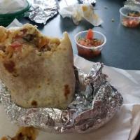 Super Burrito · Meat, rice, beans, guacamole, cheese, sour cream and salsa.
