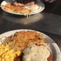 Country Fried Steak Breakfast · Breaded steak smothered with sausage gravy, served with 2 eggs any style, home fries or hash...