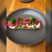 Salmon Toast · Beet cured smoked salmon, dill, cucumber relish and labneh.