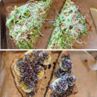 Banana Toast · Local sprouted seed bread sliced thick and toasted golden. Topped with creamy peanut butter,...