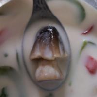 Tom Kha Soup · Sliced chicken or tofu and mushrooms in coconut cream soup, seasoned with lime juice, galang...