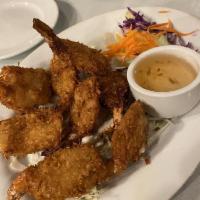 Coconut Shrimp · Shrimps dipped in batter, rolled in coconut flakes, fried until golden brown, and served wit...