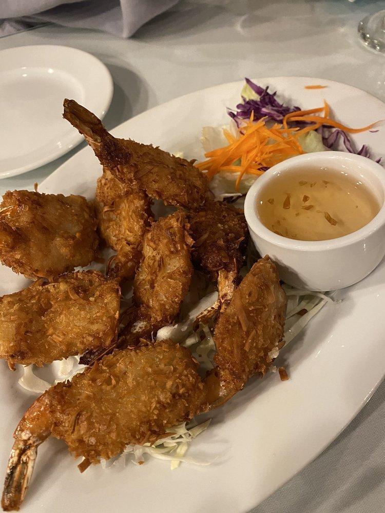 Coconut Shrimp · Shrimps dipped in batter, rolled in coconut flakes, fried until golden brown, and served with housemade plum sauce.
