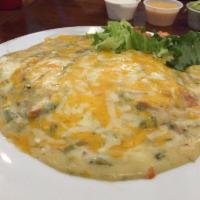 Creamy Chicken Enchilada Plate · Stuffed tortilla topped with chili sauce and creamy chicken.