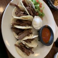 Brisket Taco Plate · 3 corn or flour tortillas filled with shrimp grilled to perfection, fresh cabbage, carameliz...