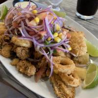 Jalea Mixta · Battered seafood mix, served with fried yucca and Peruvian salsa criolla.