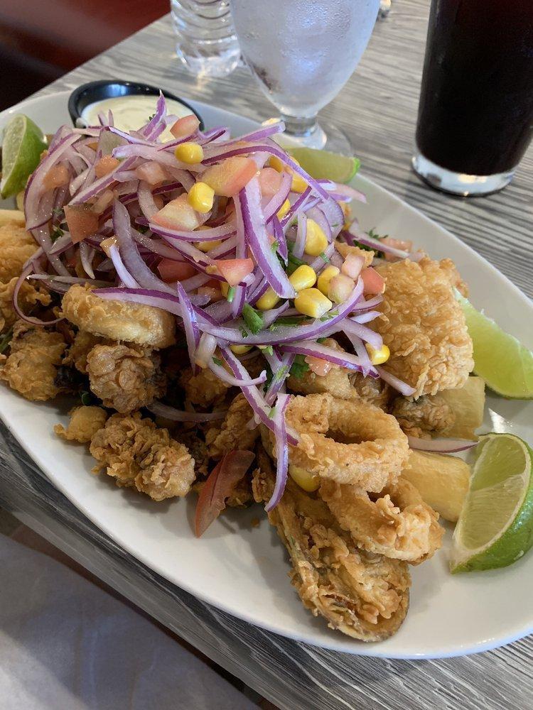 Jalea Mixta · Battered seafood mix, served with fried yucca and Peruvian salsa criolla.