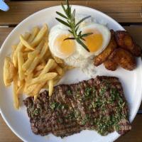Churrasco a Lo Pobre · Served with rice, fries, sweet plantains and eggs and anticuchera sauce.