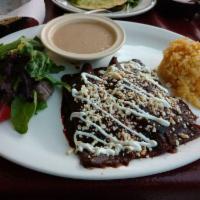 Enchiladas · Three corn tortillas stuffed with your choice of meat and then bathed in your choice of red,...