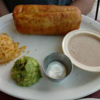 Chimichanga · Burrito with your choice of meat, lettuce, cheese, & sour cream within a flour tortilla and ...