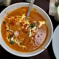 Butter Chicken Masala · Chunks of chicken cooked in a smooth, buttery and creamy tomato based gravy.