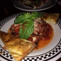 Eggplant Marino · Thinly sliced and served with our fresh tomato sauce and Romano cheese. Served family style ...